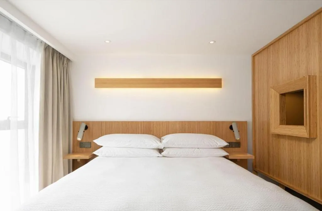 Bed in Meijin All Suites Hotel Suzhou