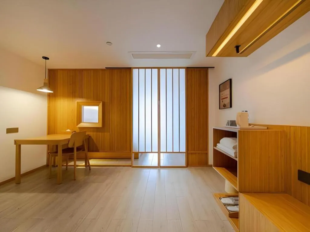 Bed in Meijin All Suites Hotel Suzhou