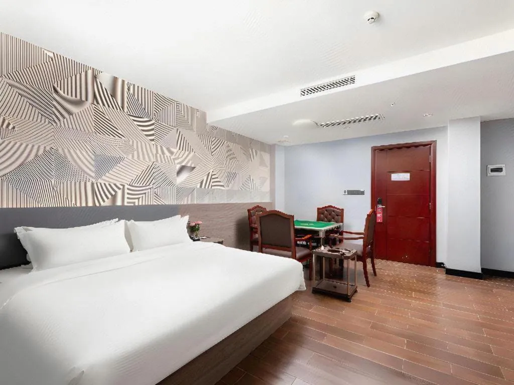 Bed in Borrman Hotel Huizhou Danshui High-speed Railway Huiyang Station