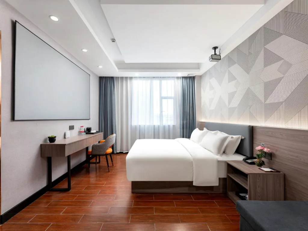 Bed in Borrman Hotel Huizhou Danshui High-speed Railway Huiyang Station