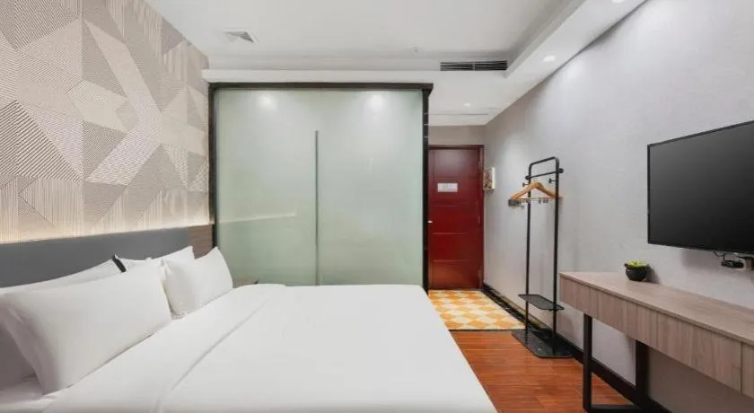 Bed in Borrman Hotel Huizhou Danshui High-speed Railway Huiyang Station