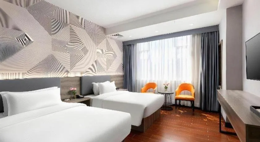 Bed in Borrman Hotel Huizhou Danshui High-speed Railway Huiyang Station