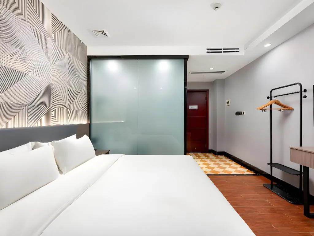 Bed in Borrman Hotel Huizhou Danshui High-speed Railway Huiyang Station