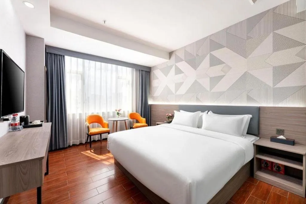 Bed in Borrman Hotel Huizhou Danshui High-speed Railway Huiyang Station