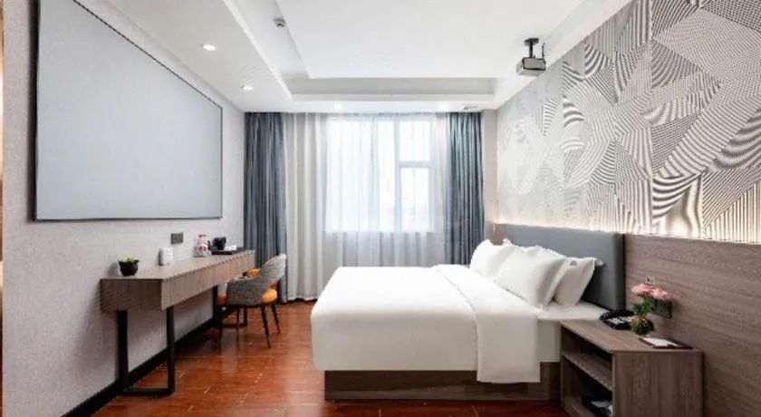 Bed in Borrman Hotel Huizhou Danshui High-speed Railway Huiyang Station