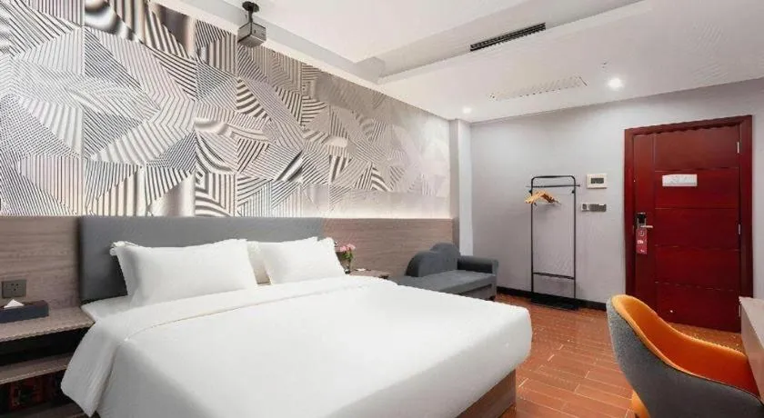 Bed in Borrman Hotel Huizhou Danshui High-speed Railway Huiyang Station