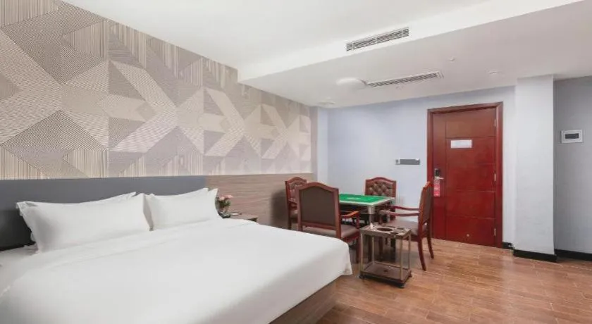 Bed in Borrman Hotel Huizhou Danshui High-speed Railway Huiyang Station