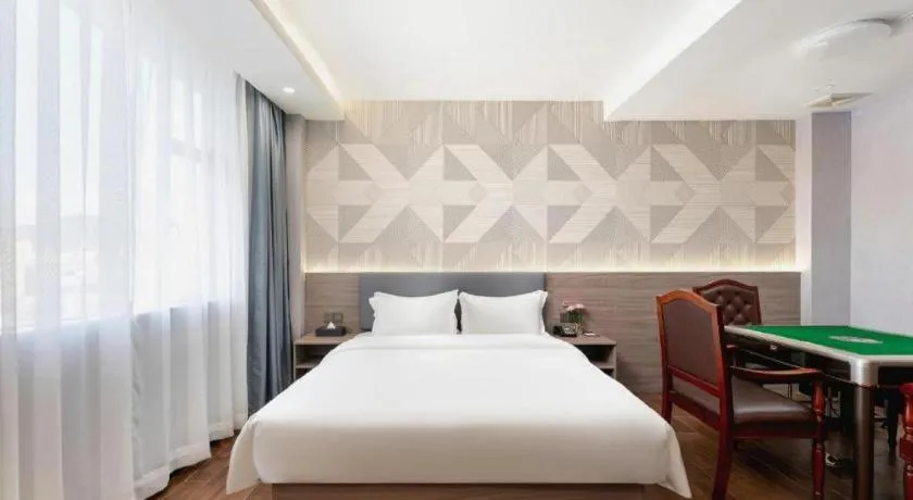 Bed in Borrman Hotel Huizhou Danshui High-speed Railway Huiyang Station