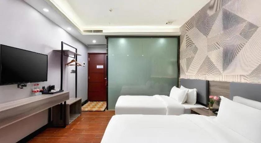 Bed in Borrman Hotel Huizhou Danshui High-speed Railway Huiyang Station