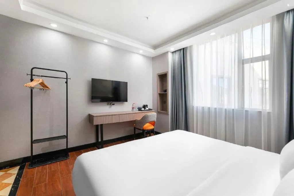 Bed in Borrman Hotel Huizhou Danshui High-speed Railway Huiyang Station