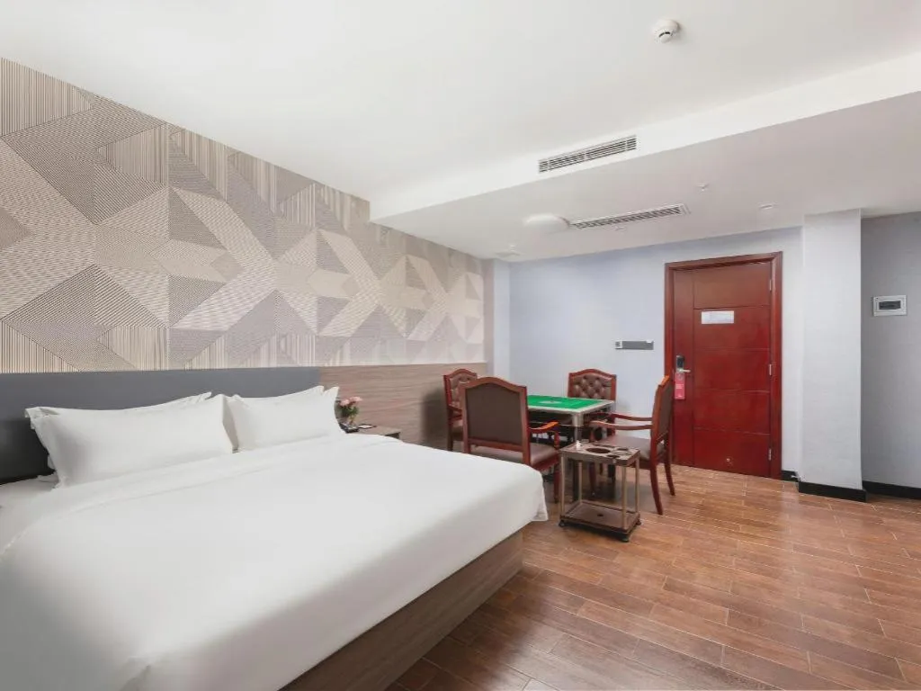 Bed in Borrman Hotel Huizhou Danshui High-speed Railway Huiyang Station