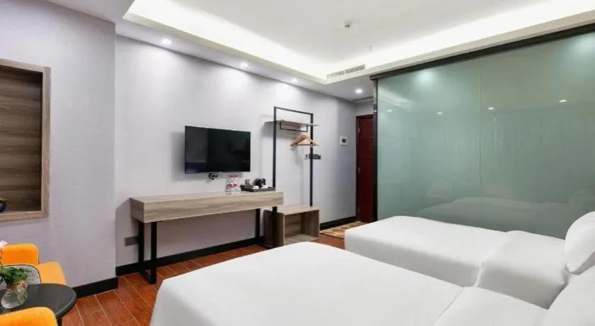 Bed in Borrman Hotel Huizhou Danshui High-speed Railway Huiyang Station