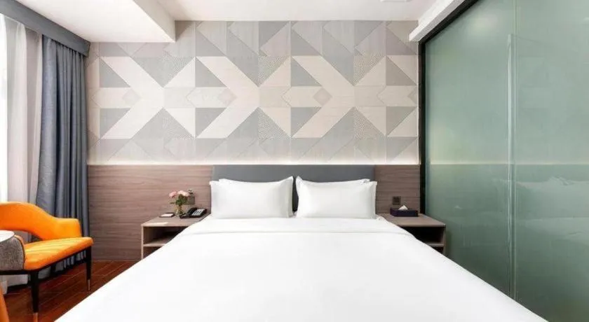 Bed in Borrman Hotel Huizhou Danshui High-speed Railway Huiyang Station