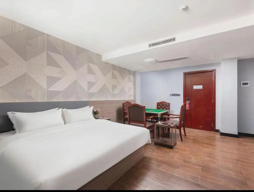 Bed in Borrman Hotel Huizhou Danshui High-speed Railway Huiyang Station