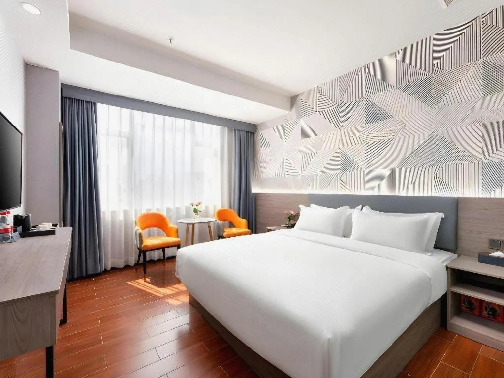 Bed in Borrman Hotel Huizhou Danshui High-speed Railway Huiyang Station