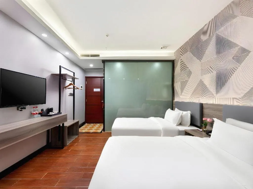 Bed in Borrman Hotel Huizhou Danshui High-speed Railway Huiyang Station