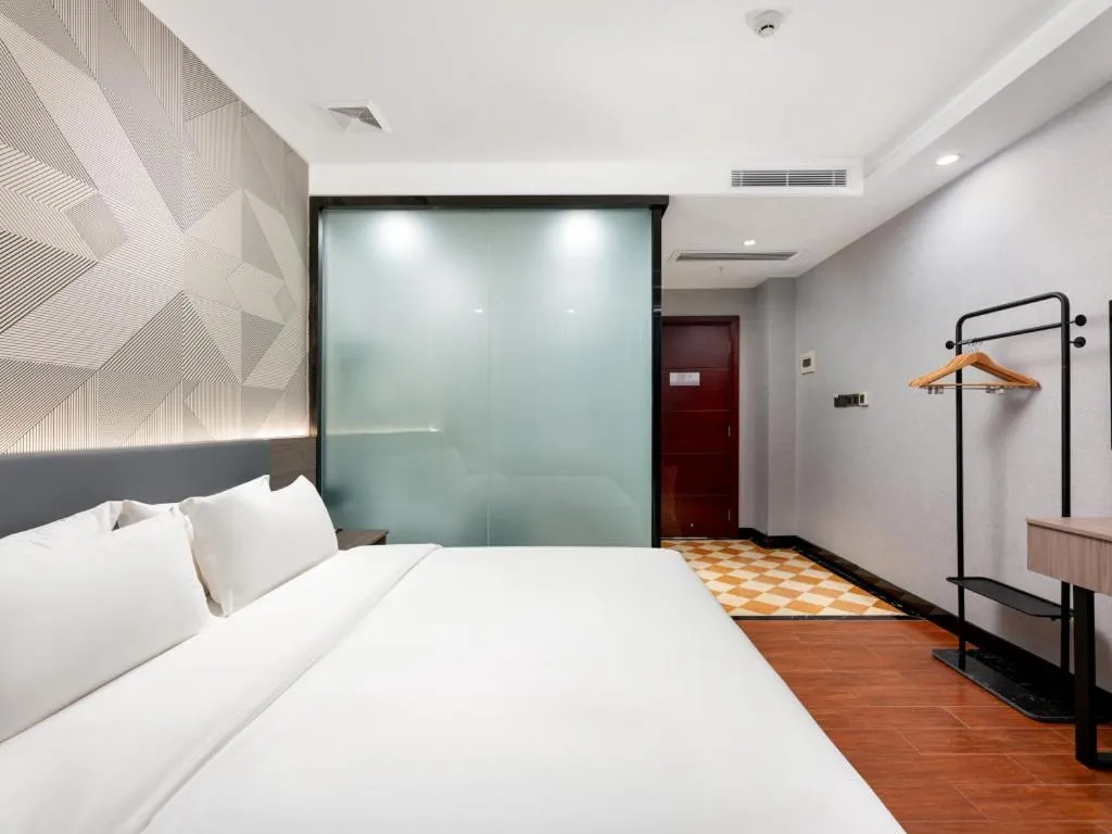 Bed in Borrman Hotel Huizhou Danshui High-speed Railway Huiyang Station