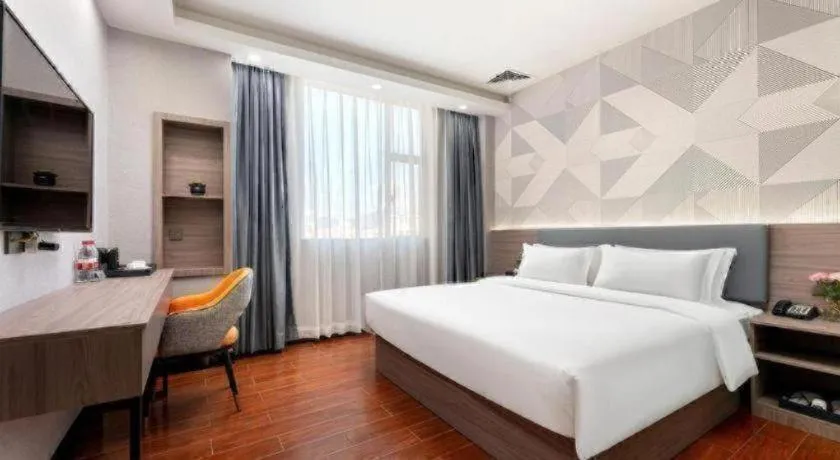 Bed in Borrman Hotel Huizhou Danshui High-speed Railway Huiyang Station