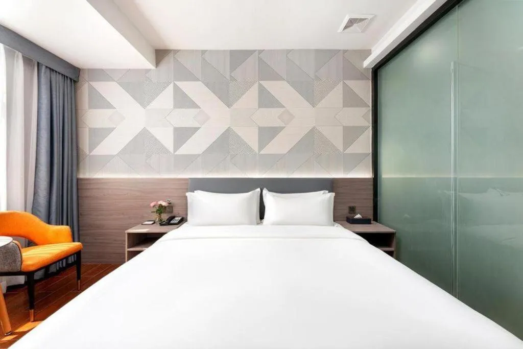 Bed in Borrman Hotel Huizhou Danshui High-speed Railway Huiyang Station