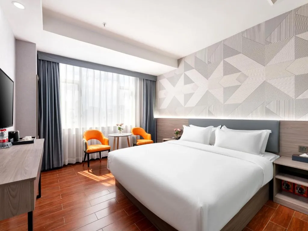 Bed in Borrman Hotel Huizhou Danshui High-speed Railway Huiyang Station