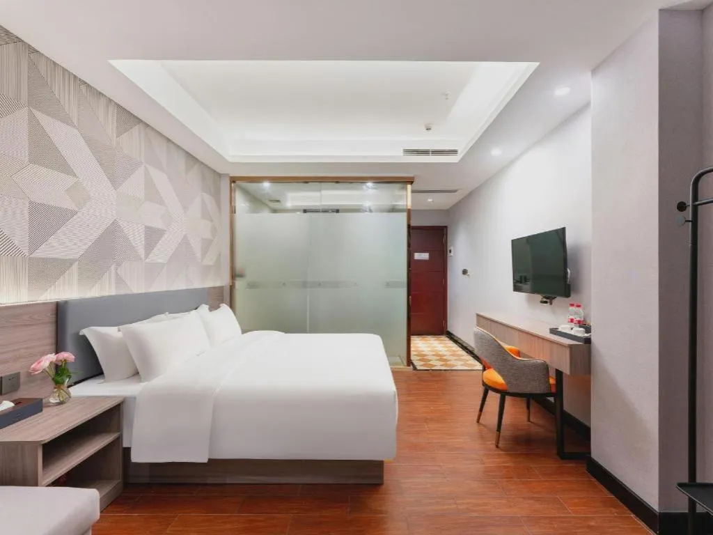 Bed in Borrman Hotel Huizhou Danshui High-speed Railway Huiyang Station