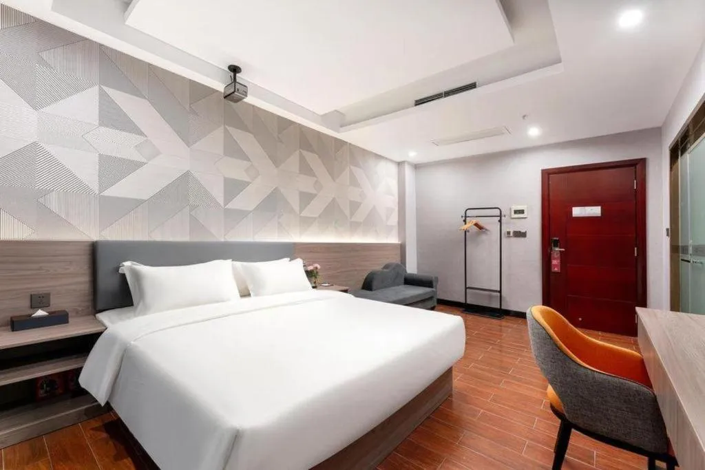 Bed in Borrman Hotel Huizhou Danshui High-speed Railway Huiyang Station