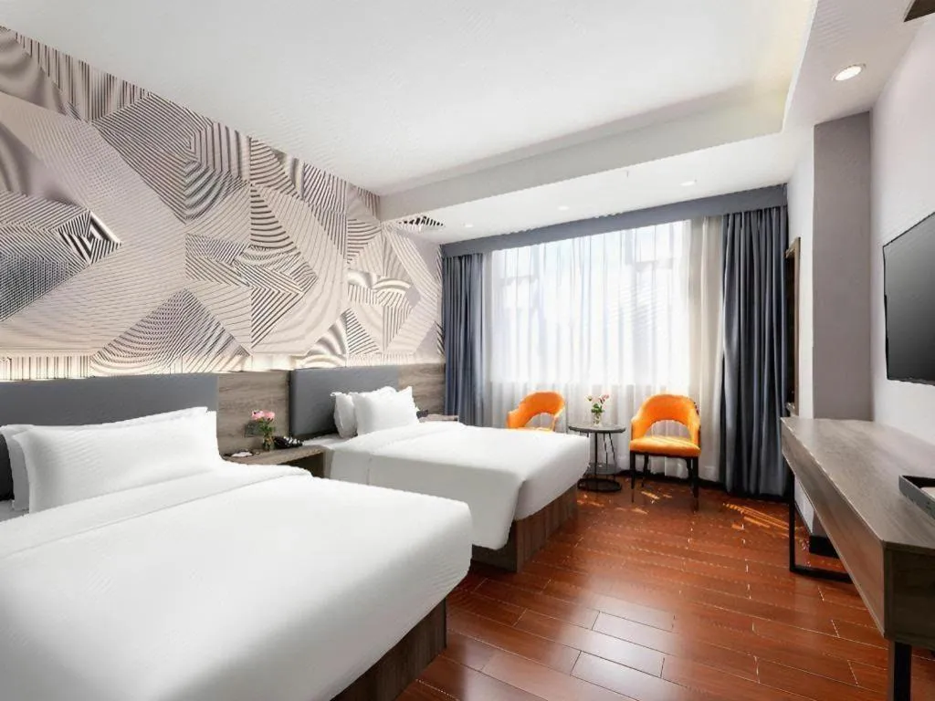 Bed in Borrman Hotel Huizhou Danshui High-speed Railway Huiyang Station