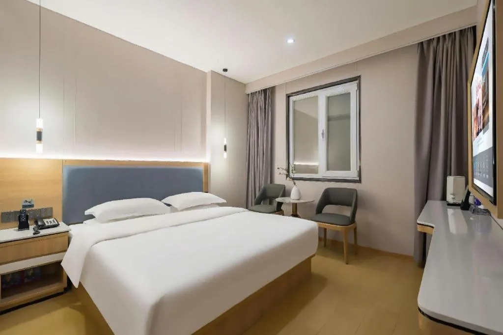 Bed in Borrman Hotel South Beijing Railway Station Caoqiao Station