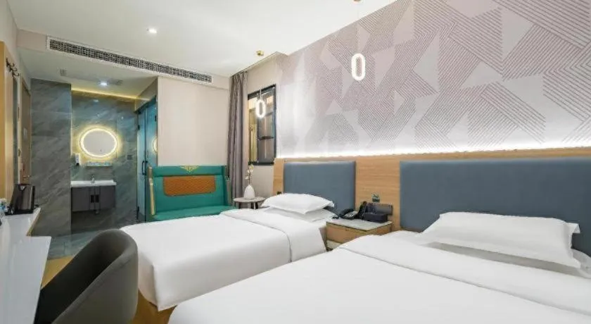 Bed in Borrman Hotel South Beijing Railway Station Caoqiao Station