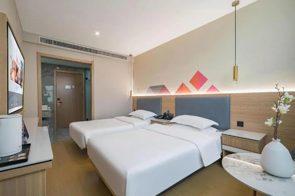 Bed in Borrman Hotel South Beijing Railway Station Caoqiao Station