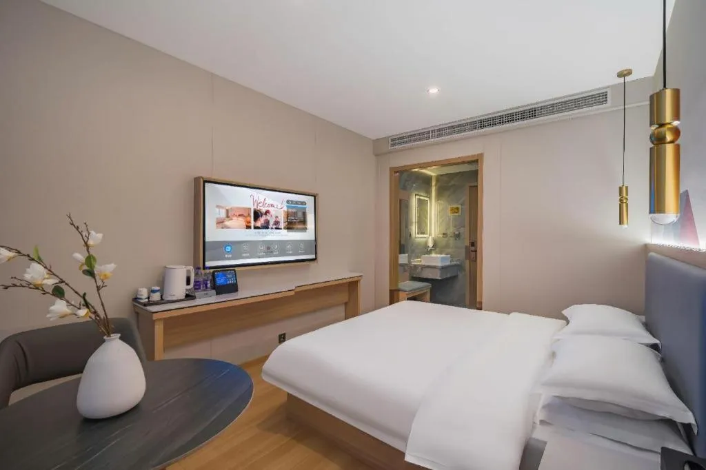 Bed in Borrman Hotel South Beijing Railway Station Caoqiao Station