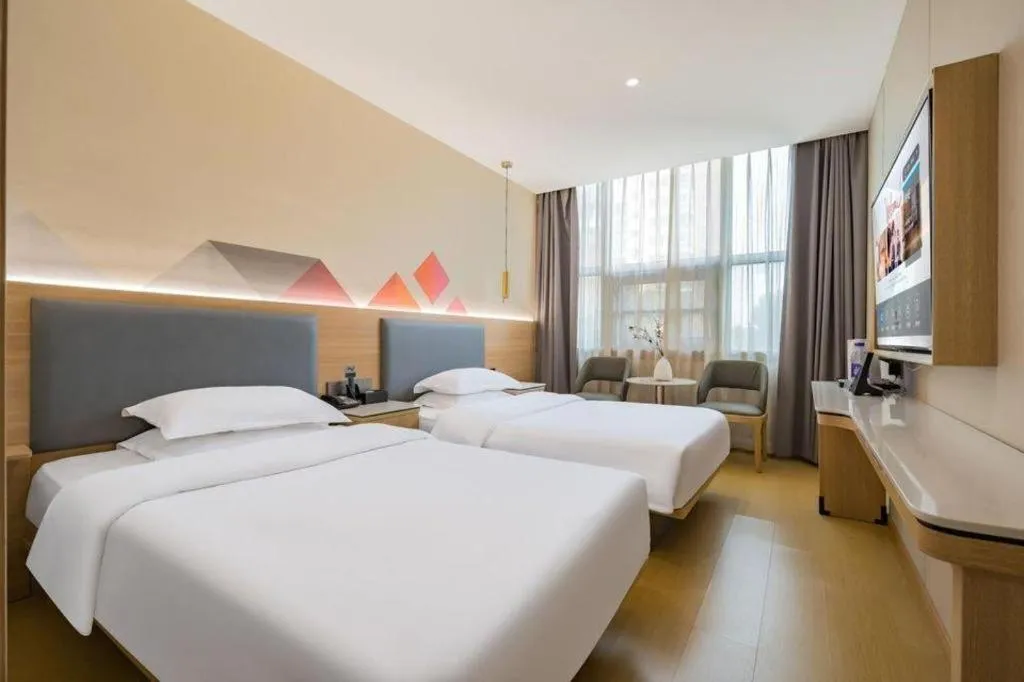 Bed in Borrman Hotel South Beijing Railway Station Caoqiao Station