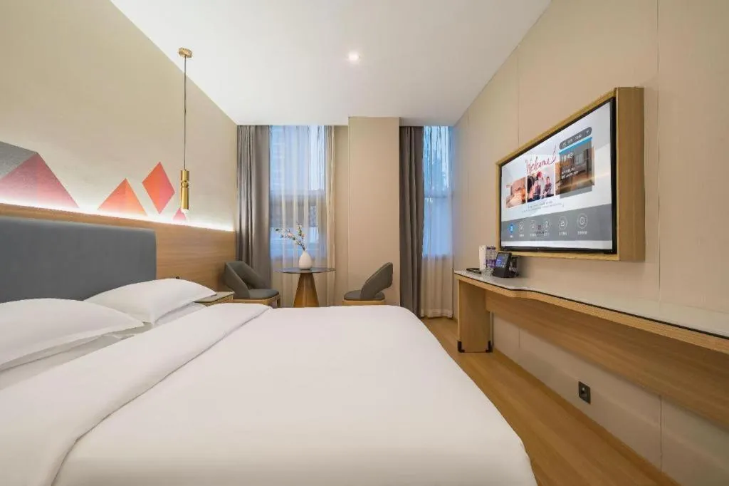 Bed in Borrman Hotel South Beijing Railway Station Caoqiao Station