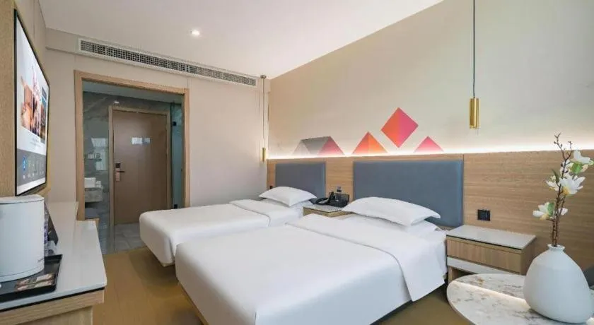 Bed in Borrman Hotel South Beijing Railway Station Caoqiao Station