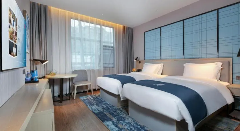 Bed in Echarm Hotel Chengdu Global Center Century City New Exhibition