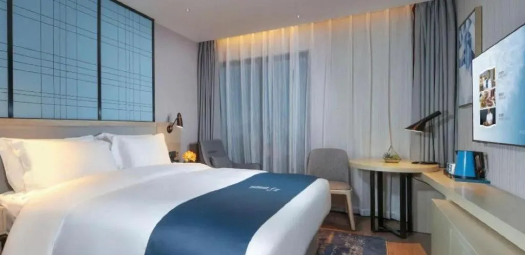 Bed in Echarm Hotel Chengdu Global Center Century City New Exhibition