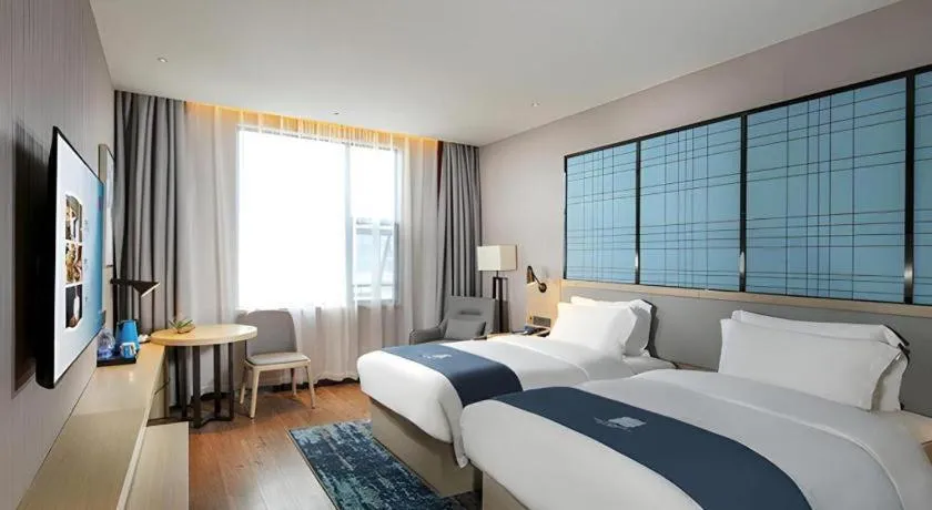 Bed in Echarm Hotel Chengdu Global Center Century City New Exhibition