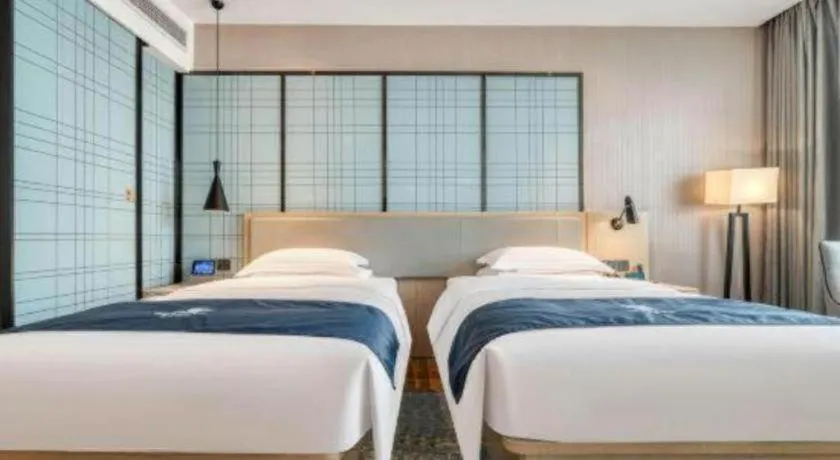 Bed in Echarm Hotel Chengdu Global Center Century City New Exhibition