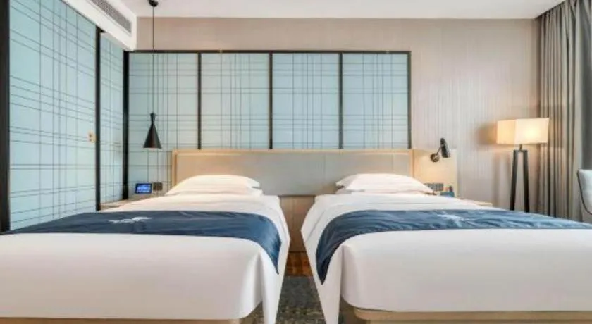 Bed in Echarm Hotel Chengdu Global Center Century City New Exhibition