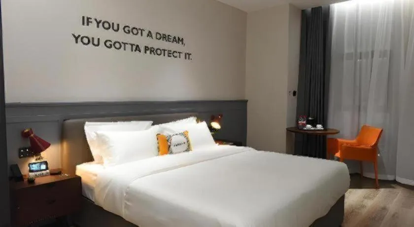 Bed in Premier City Comfort Hotel Hechi Luocheng Central Plaza