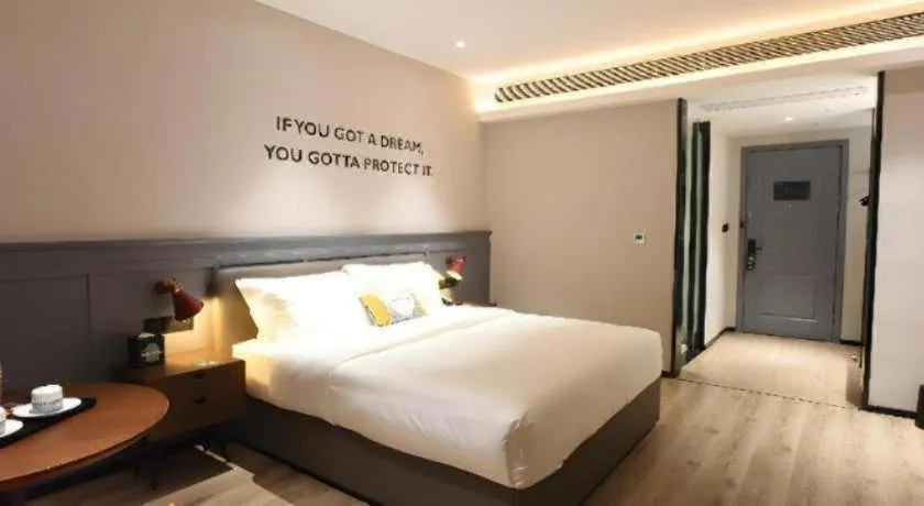Bed in Premier City Comfort Hotel Hechi Luocheng Central Plaza