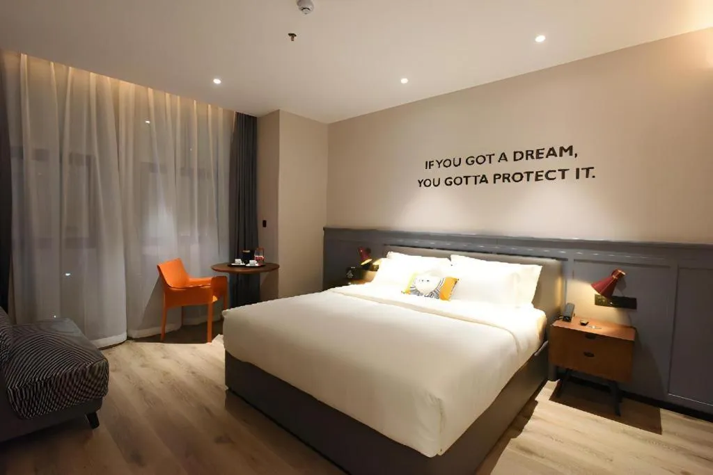 Bed in Premier City Comfort Hotel Hechi Luocheng Central Plaza