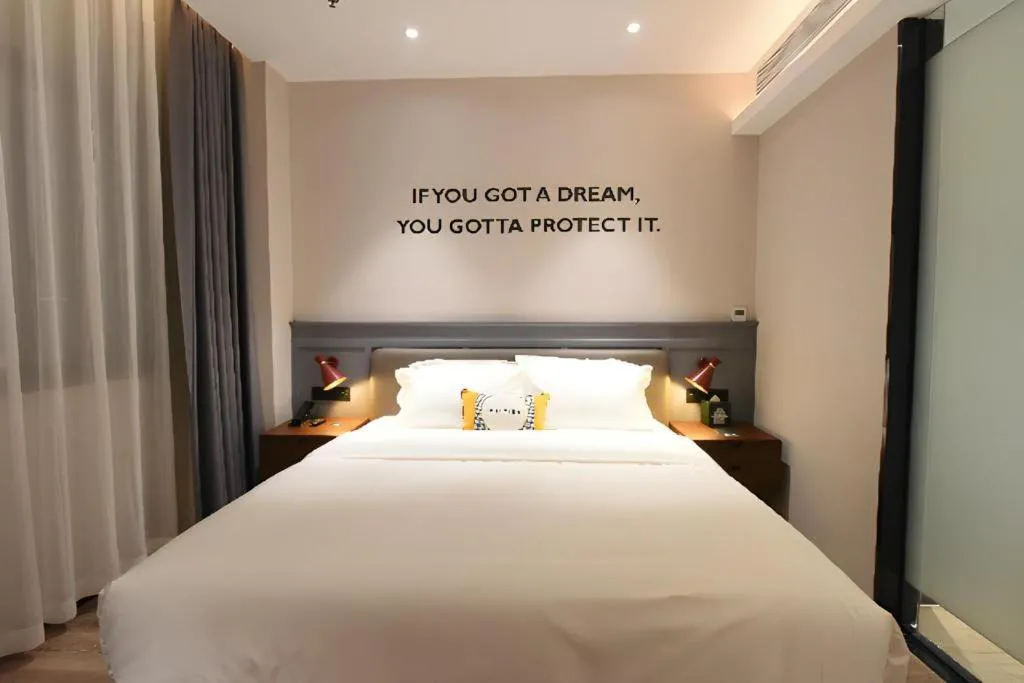 Bed in Premier City Comfort Hotel Hechi Luocheng Central Plaza