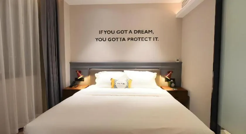 Bed in Premier City Comfort Hotel Hechi Luocheng Central Plaza