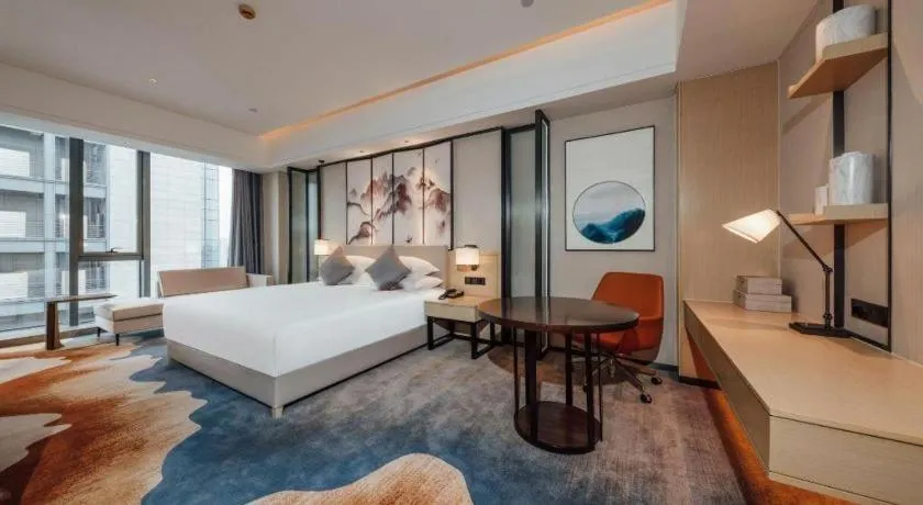 Bed in New Century Grand Hotel Ningbo Zhongdu