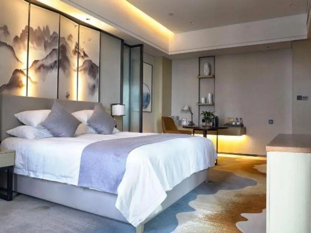 Bed in New Century Grand Hotel Ningbo Zhongdu
