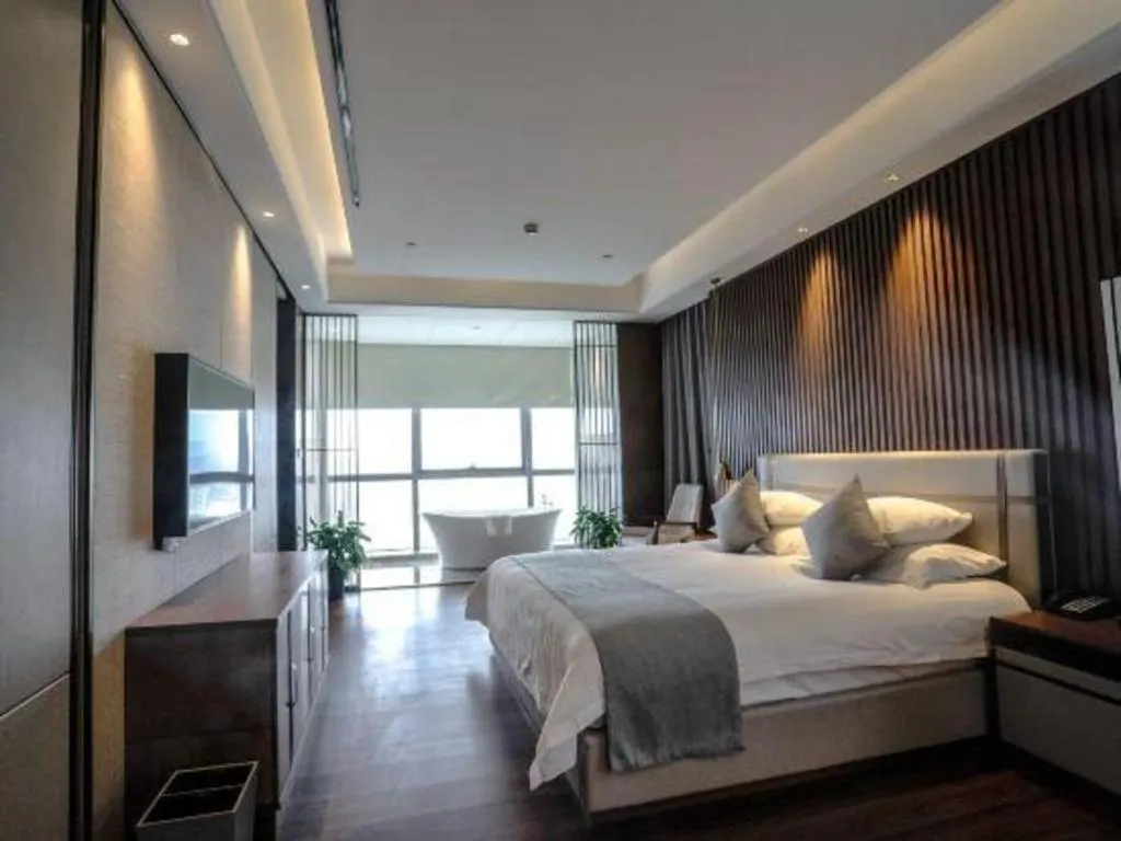 Bed in New Century Grand Hotel Ningbo Zhongdu