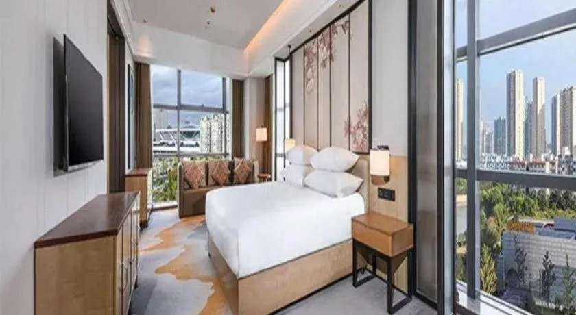 Bed in New Century Grand Hotel Ningbo Zhongdu