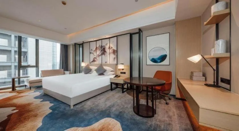Bed in New Century Grand Hotel Ningbo Zhongdu