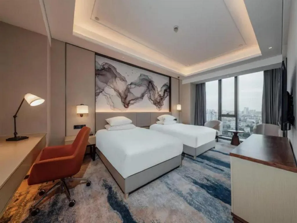 Bed in New Century Grand Hotel Ningbo Zhongdu